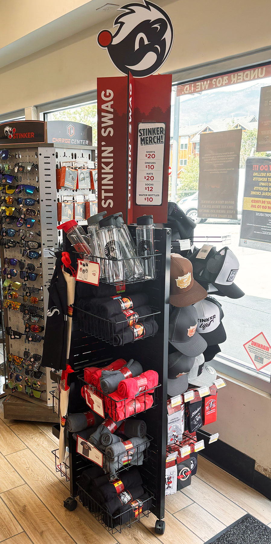 PanelRak pinwheel shoparound with baskets hooks for swag shopping in Stinker Store