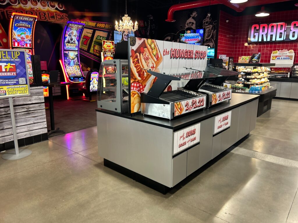 Modular convenience store foodservice island designed for flexible equipment and merchandising configurations
