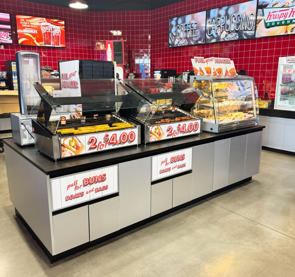 Convenience store foodservice island with integrated equipment, merchandising and customer-facing access
